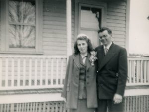 Joyce and Walter in front of Walter's family home in North Reading on the way to their honeymoon.
