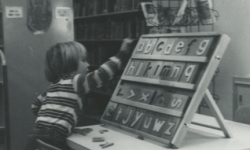 Kid playing with an alphabet board