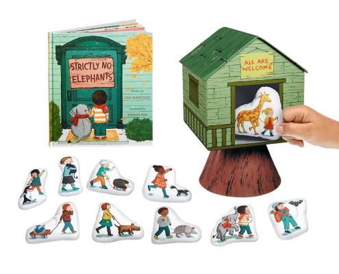 Children’s book Strictly No Elephants, a green toy house, and 10 illustrated character pieces, including children and animals. A hand places one piece, showing a child with a giraffe, into the house.