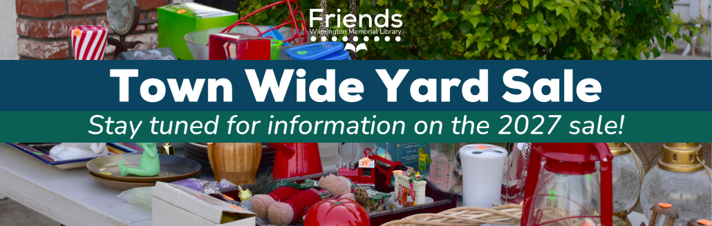 A table filled with various items for sale at a yard sale. Overlaid text reads: Town Wide Yard Sale. Stay tuned for information on the 2027 sale! Friends Wilmington Memorial Library.