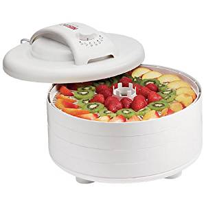 Food dehydrator with lid open showing fruit