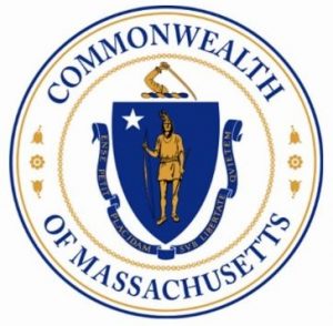 The Massachusetts State Seal: A Native American in a Blue Shield with a scroll below that saying Republic of Massachusetts, in Latin, inside a circle with the word Commonwealth at the top and Of Massachusetts at the bottom.