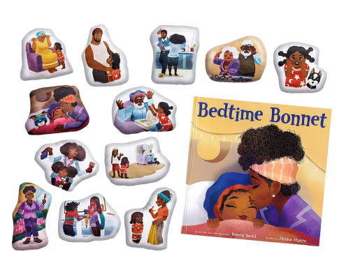 Plush story characters and scenes surround the children’s book Bedtime Bonnet by Nancy Redd, featuring a Black family’s nighttime hair care routine.